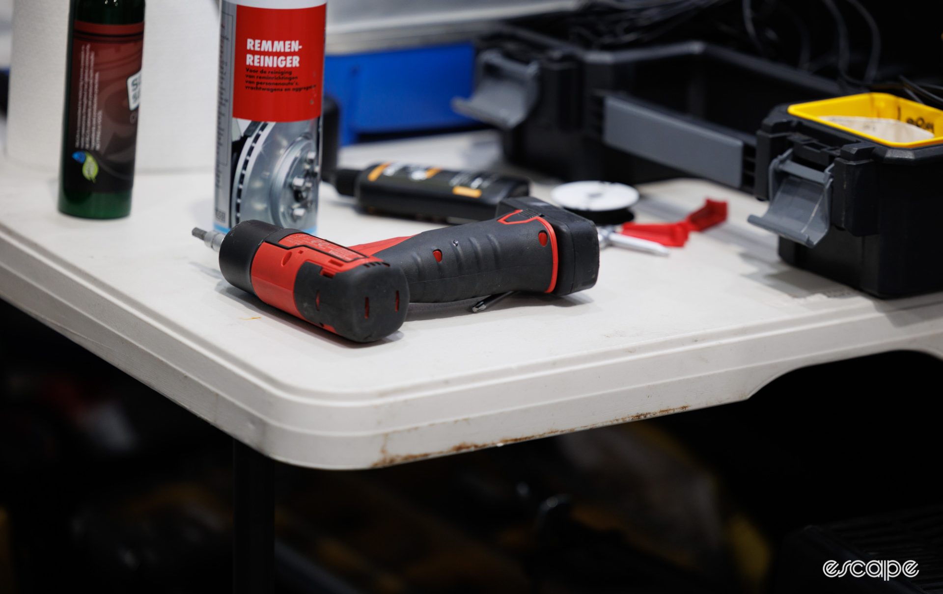 A Snap-On impact driver sits on a bench. 