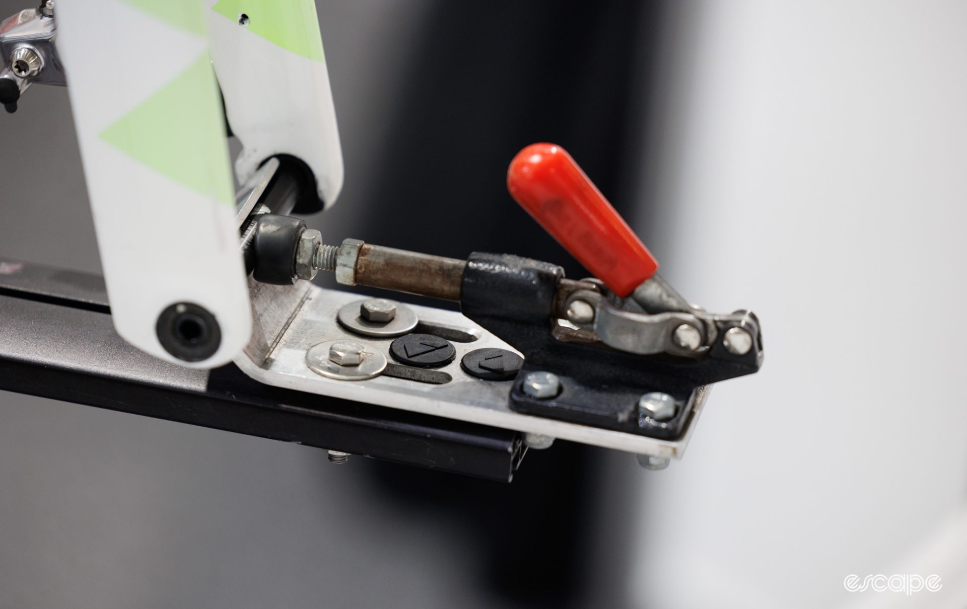 A quick toggle clamp is adapter for use on a bicycle race repair stand. 