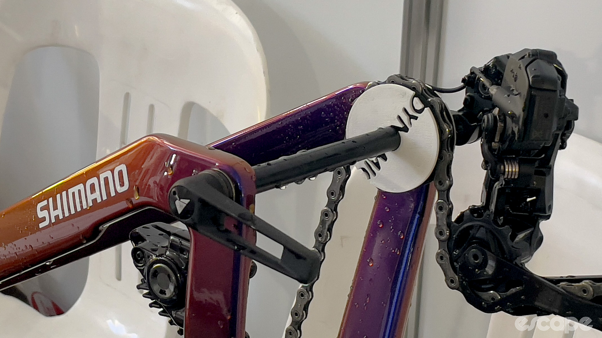 The photo shows a chain keeper attached to a Canyon bike to prevent the chain rattling in transit. 