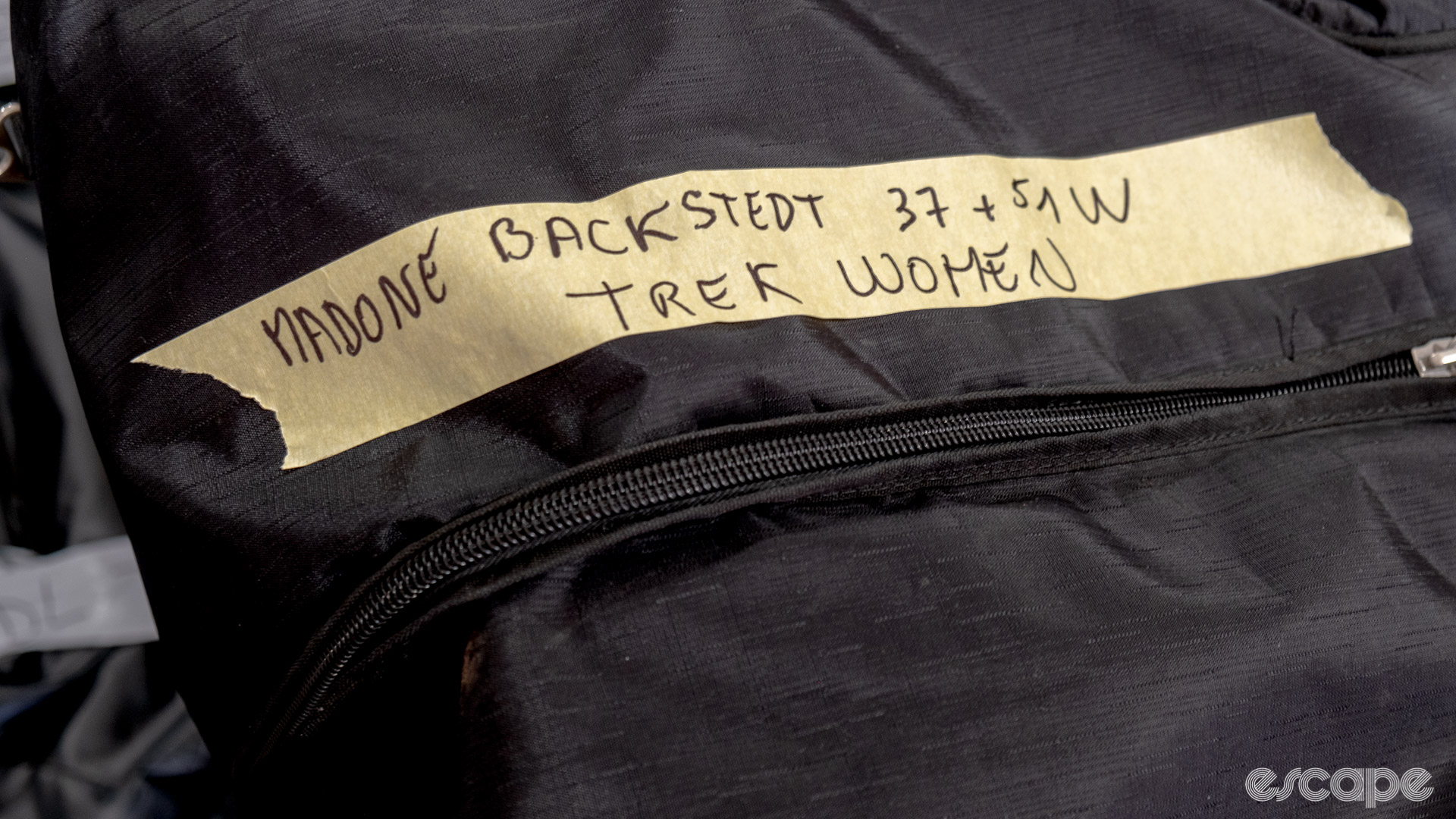The photo shows a label noting Elynor Backstedt's Trek Madone is packed in this bag. 