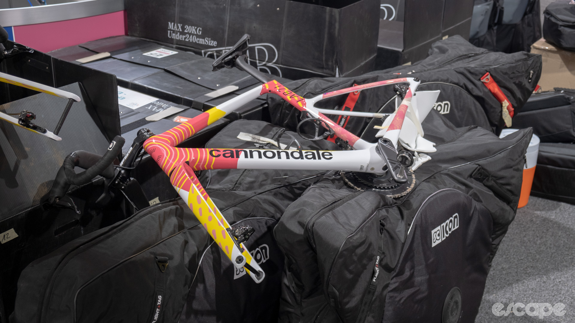 The photo shows a Cannondale waiting to be packed into a bike bag. 