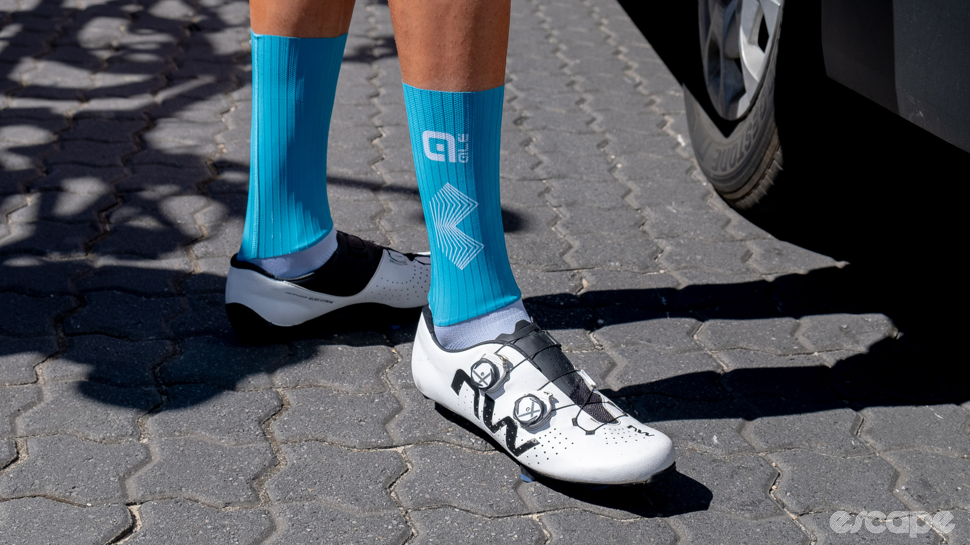 The photo shows blue Bahrain-Victorious team aero socks and Northwave's new Veloce shoes in white. 