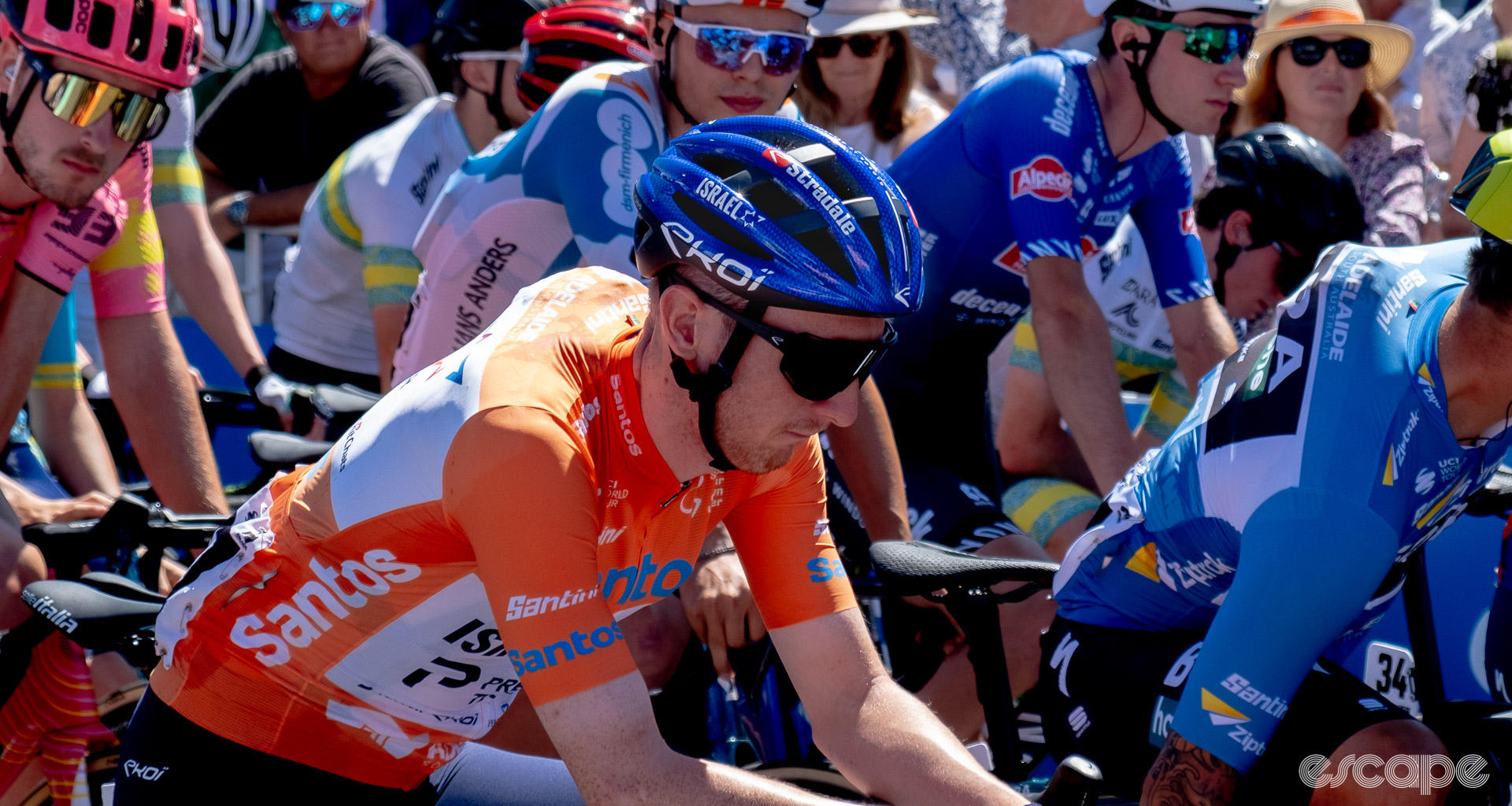 The photo shows Stevie Williams waiting for the stage start in the Tour Down Under's leader's jersey with a blue Ekoi Legende vented helmet.