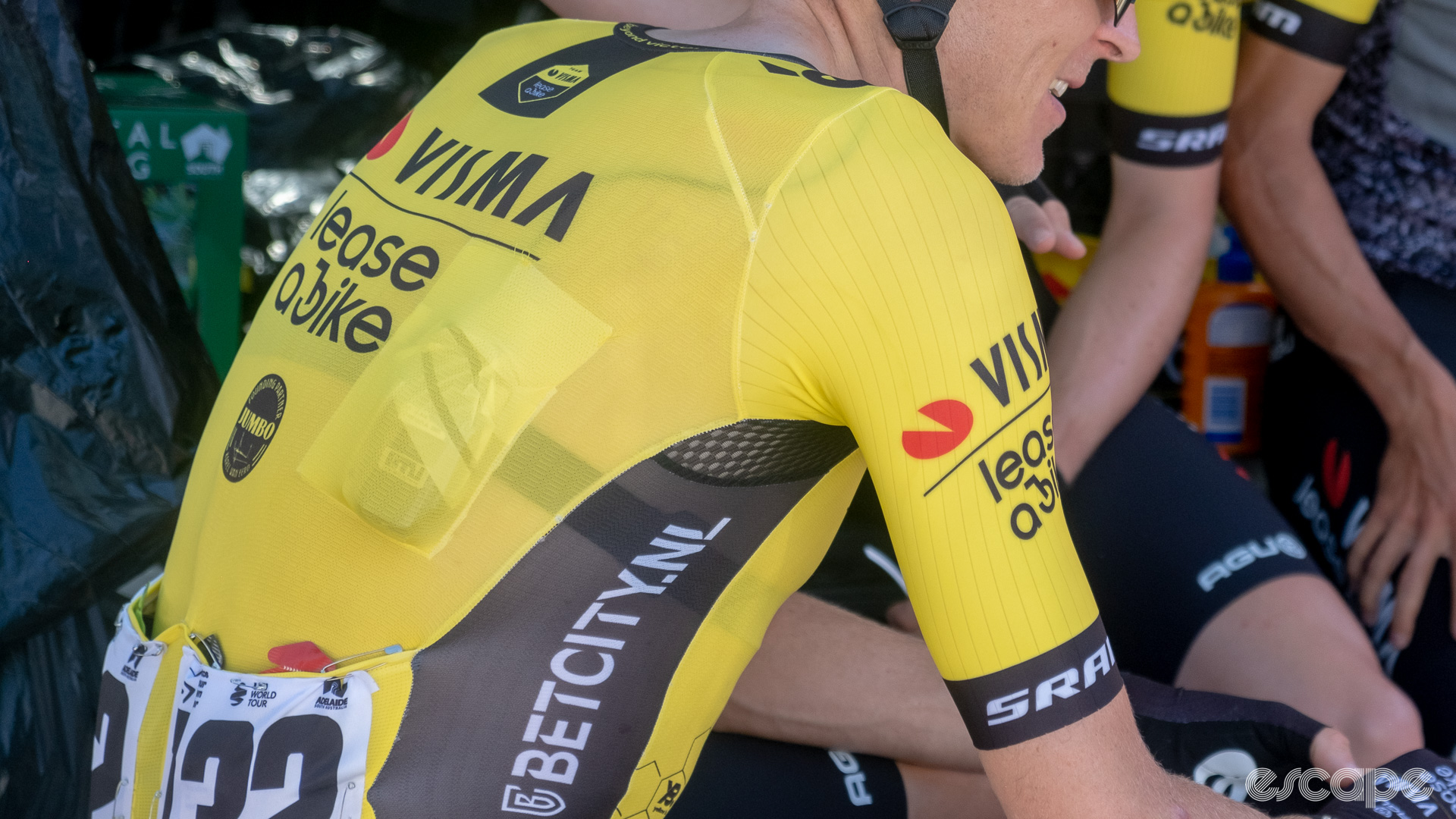 The photo shows a Visma-Lease a bike team jersey sleeve.