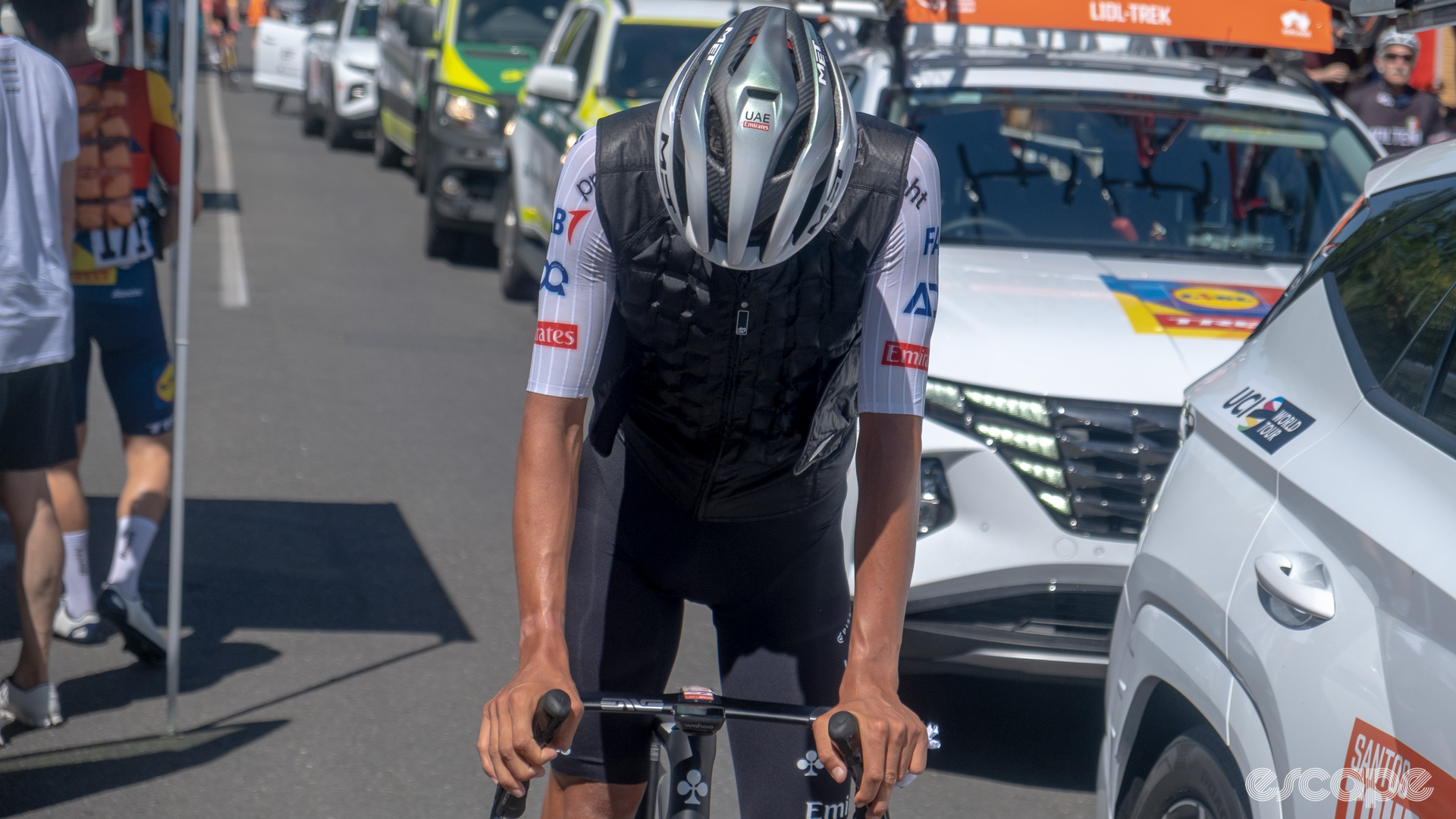 The photo shows a Isaac Del Toro of UAE Team Emirates wearing a black ice vest. 