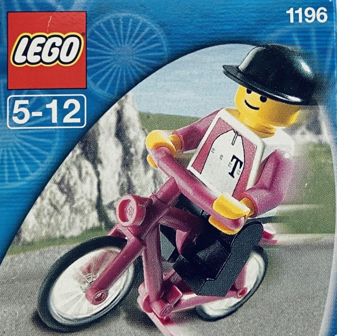 A scan of box, featuring a Lego cyclist zooming on a mountainous backdrop. 