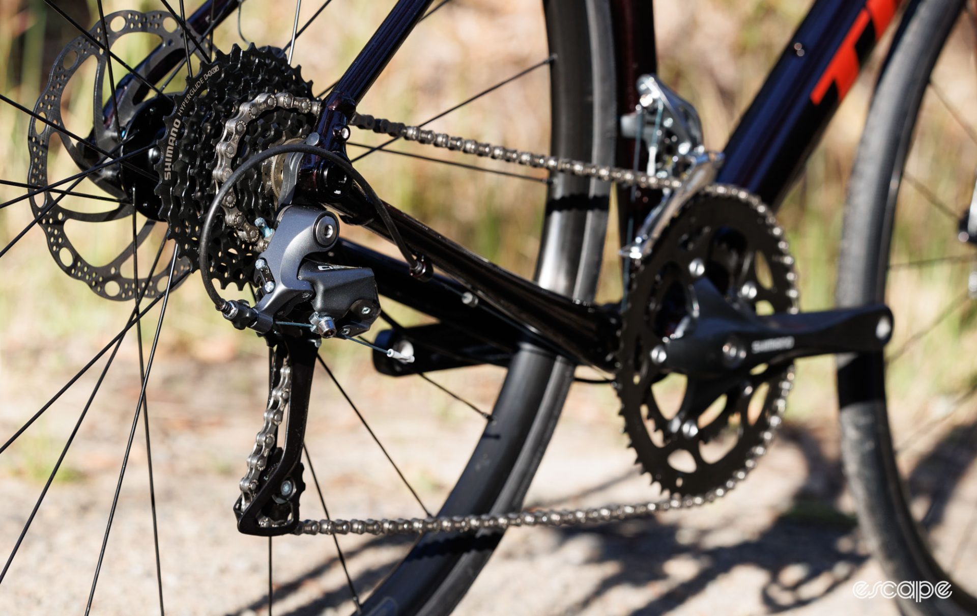 The Shimano Claris drivetrain in view, with a focus on the rear derailleur. 