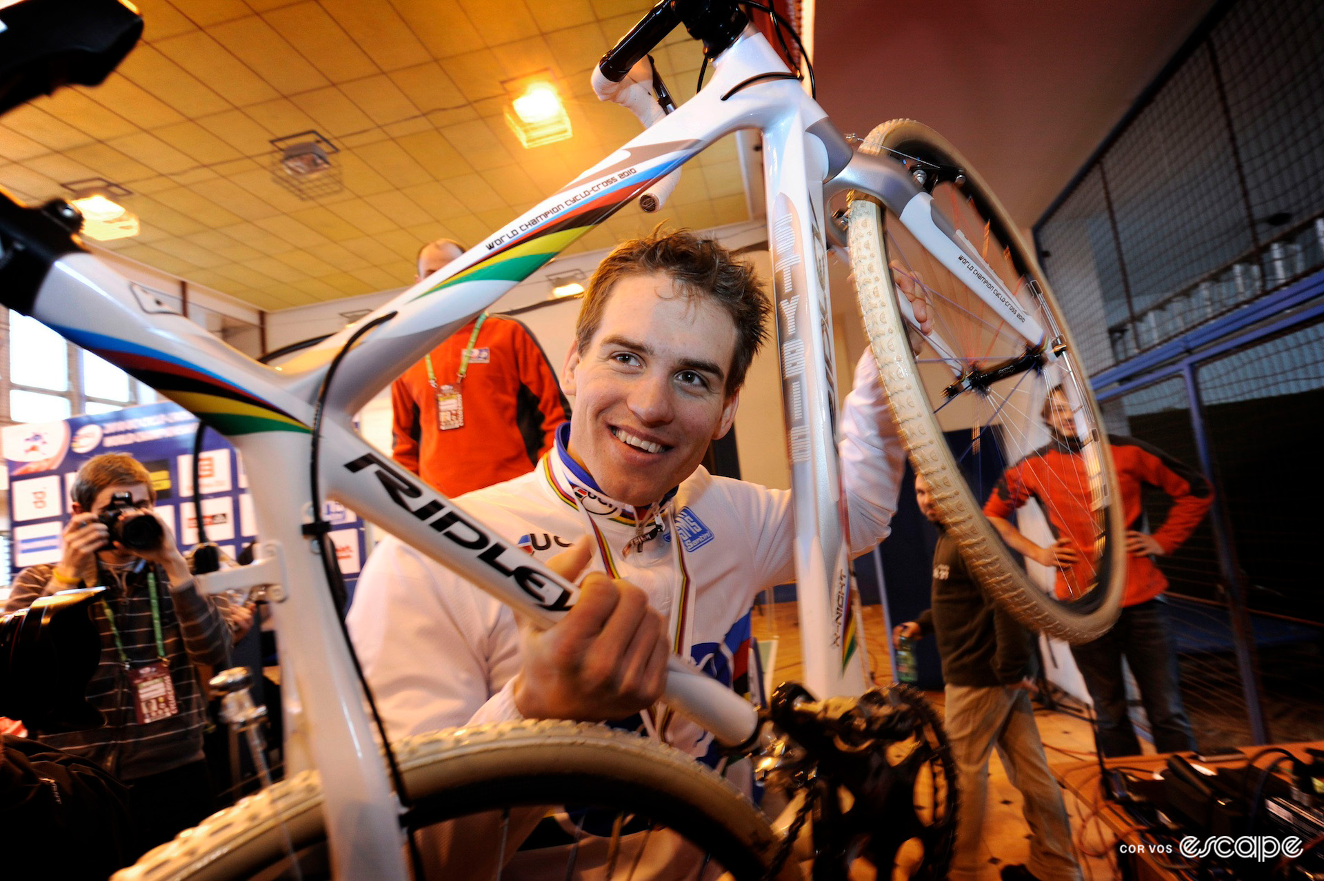 Image of Zdeněk Štybar receiving a special rainbow edition Ridley bike in the winner's press conference at the 2010 Cyclocross World Championships in Tábor.