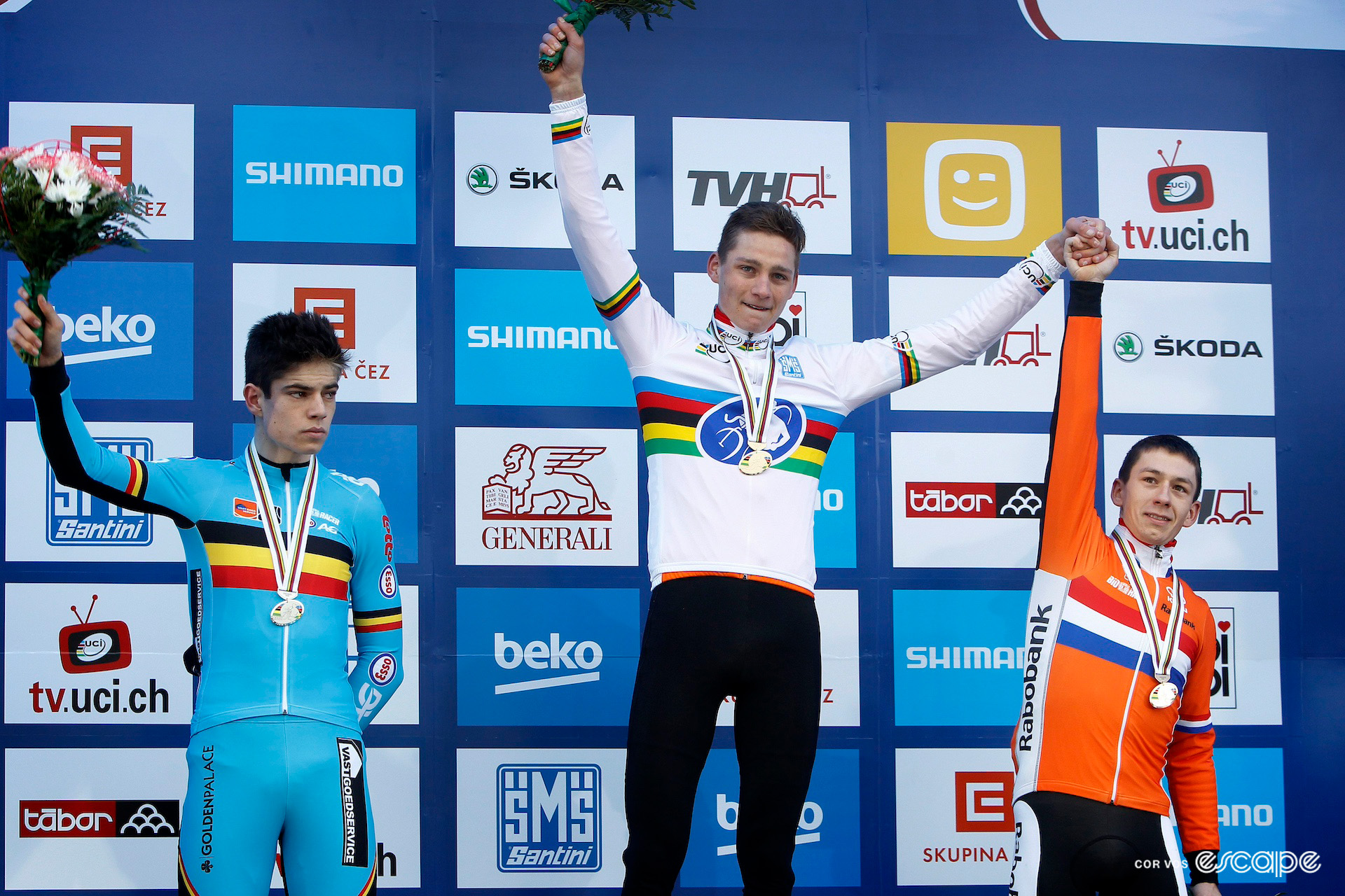 Mathieu van der Poel flanked by second-place Wout van Aert and third Lars van der Haar on the elite men's podium at the 2015 Cyclocross World Championships in Tábor.