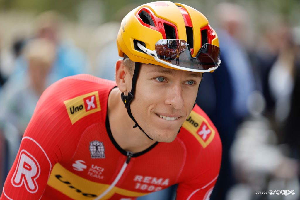 Tobias Halland Johanessen is pictured in profile in a race. His glasses are tucked into his helmet vents and his youthful face has a confident air to it.