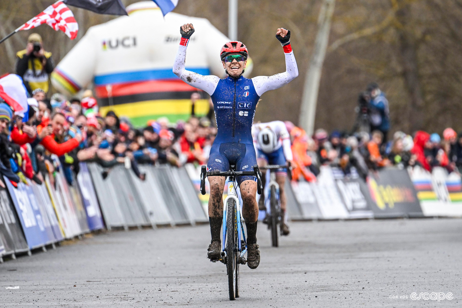 French rider Célia Gery celebrates winning the junior women's title ahead of Britain's Cat Ferguson during the UCI Cyclo-Cross World Championships in Tábor.