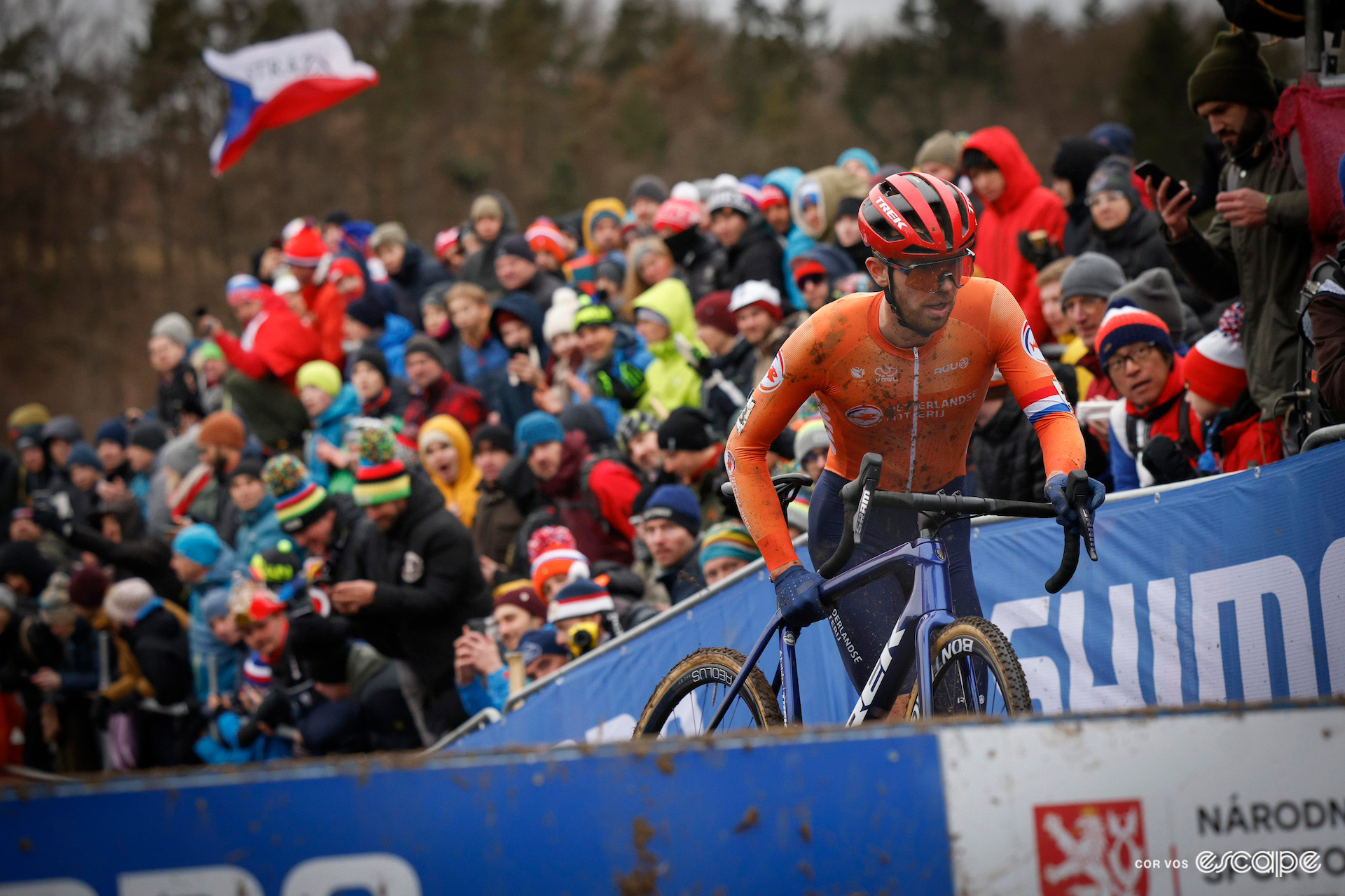 Dutchman Joris Nieuwenhuis prepares to lift his bike over the planks in front of a deep crowd during the 2024 Cyclocross World Championships in Tábor.