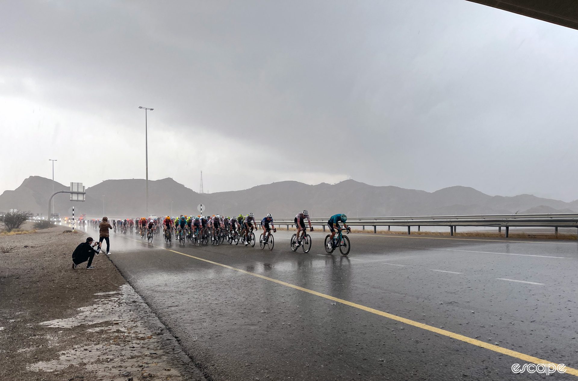The rain pours on the riders at the Tour of Oman.