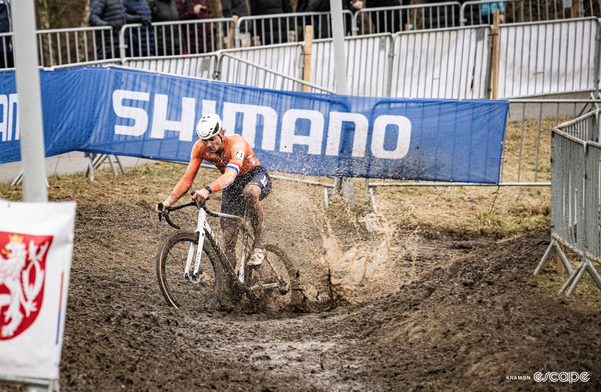 Mathieu van der Poel splashes through a mud puddle during the 2024 Cyclocross World Championships in Tábor.