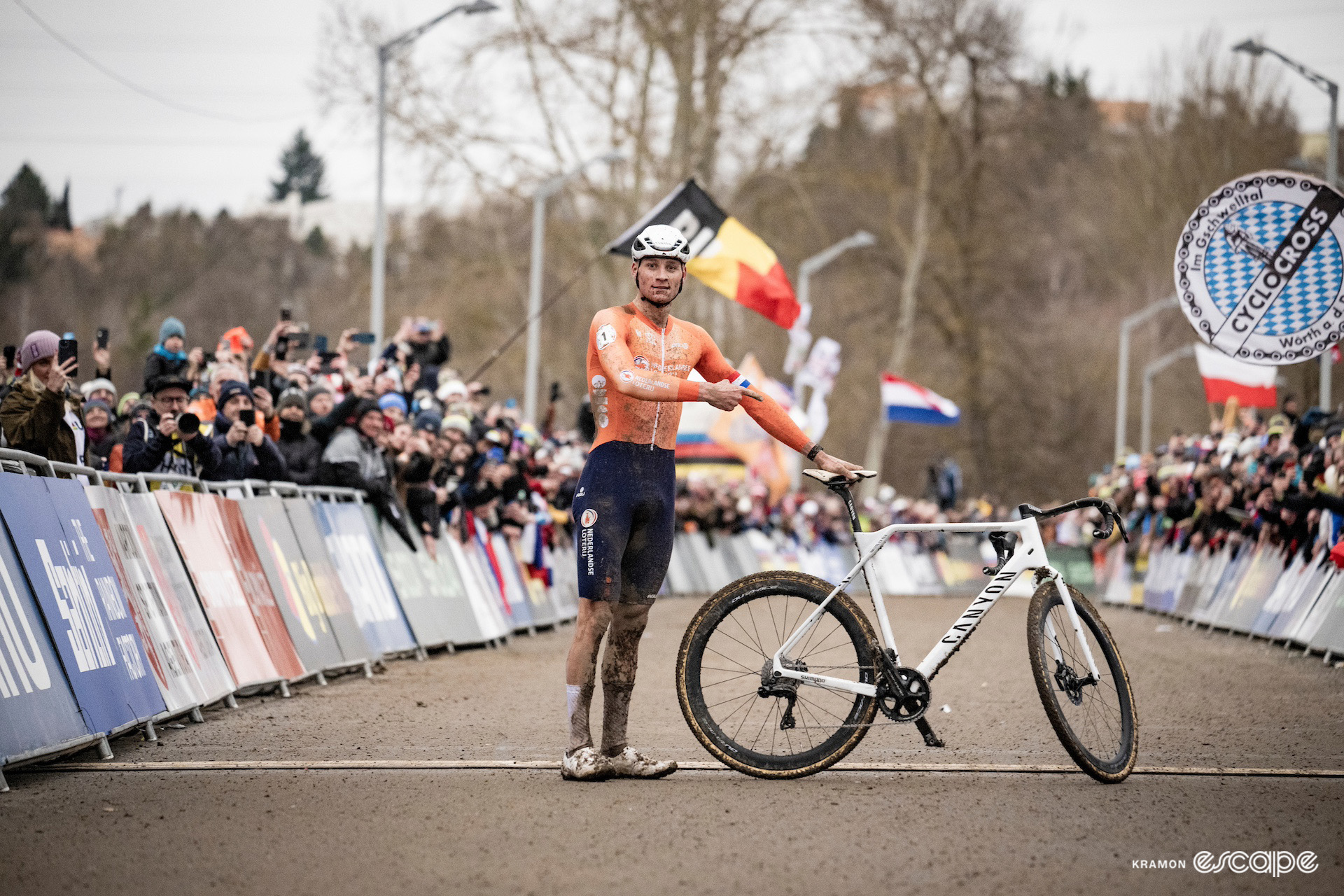 Mathieu van der Poel points at his bike at the finish line after winning the 2024 Cyclocross World Championships in Tábor.