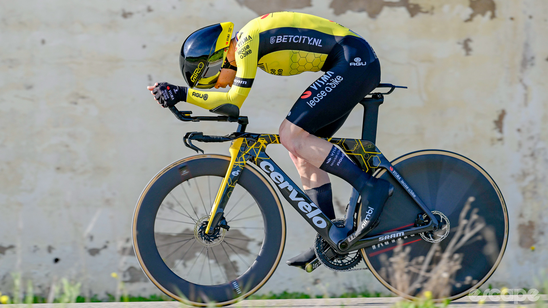 The photo shows a Visma-Lease a Bike rider racing on what appears to be a new Cervelo P5.
