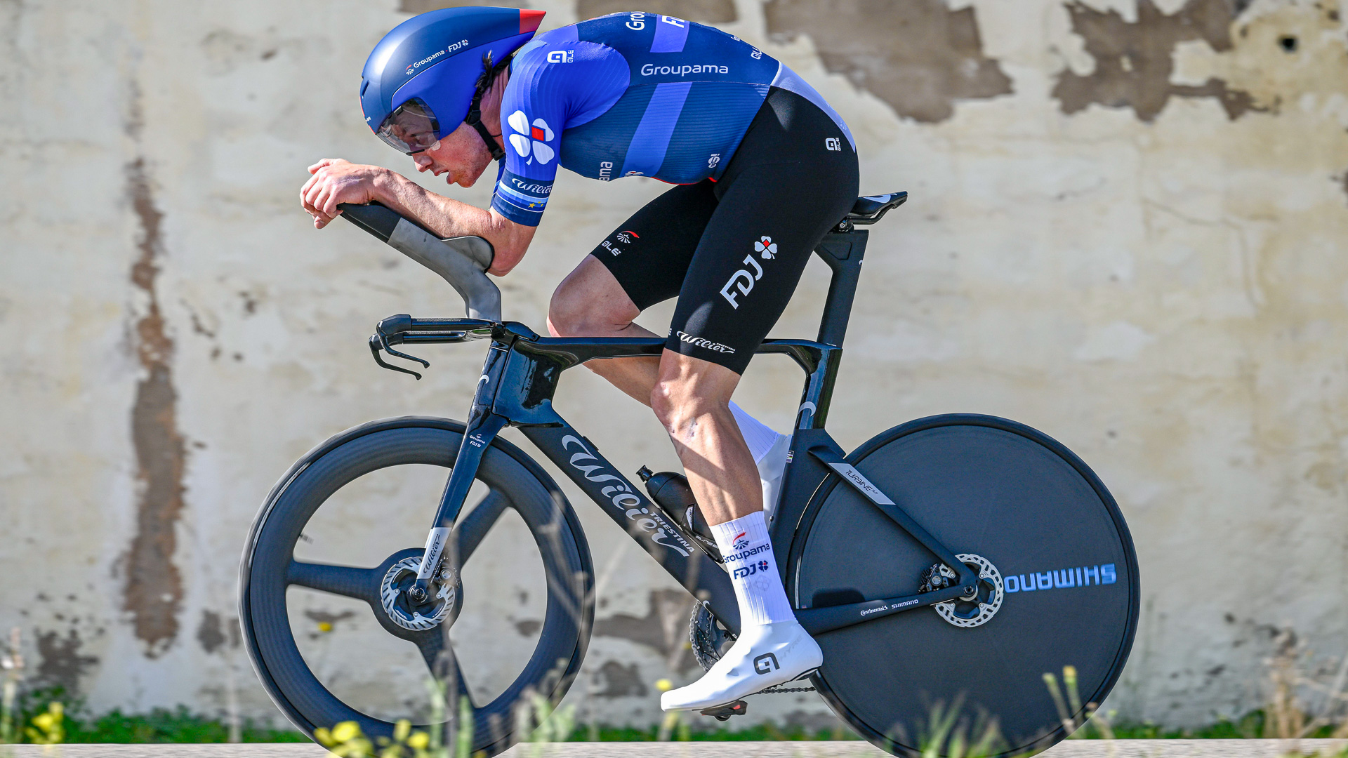 The image shows Stefan Kung time trialling on a Wilier. 