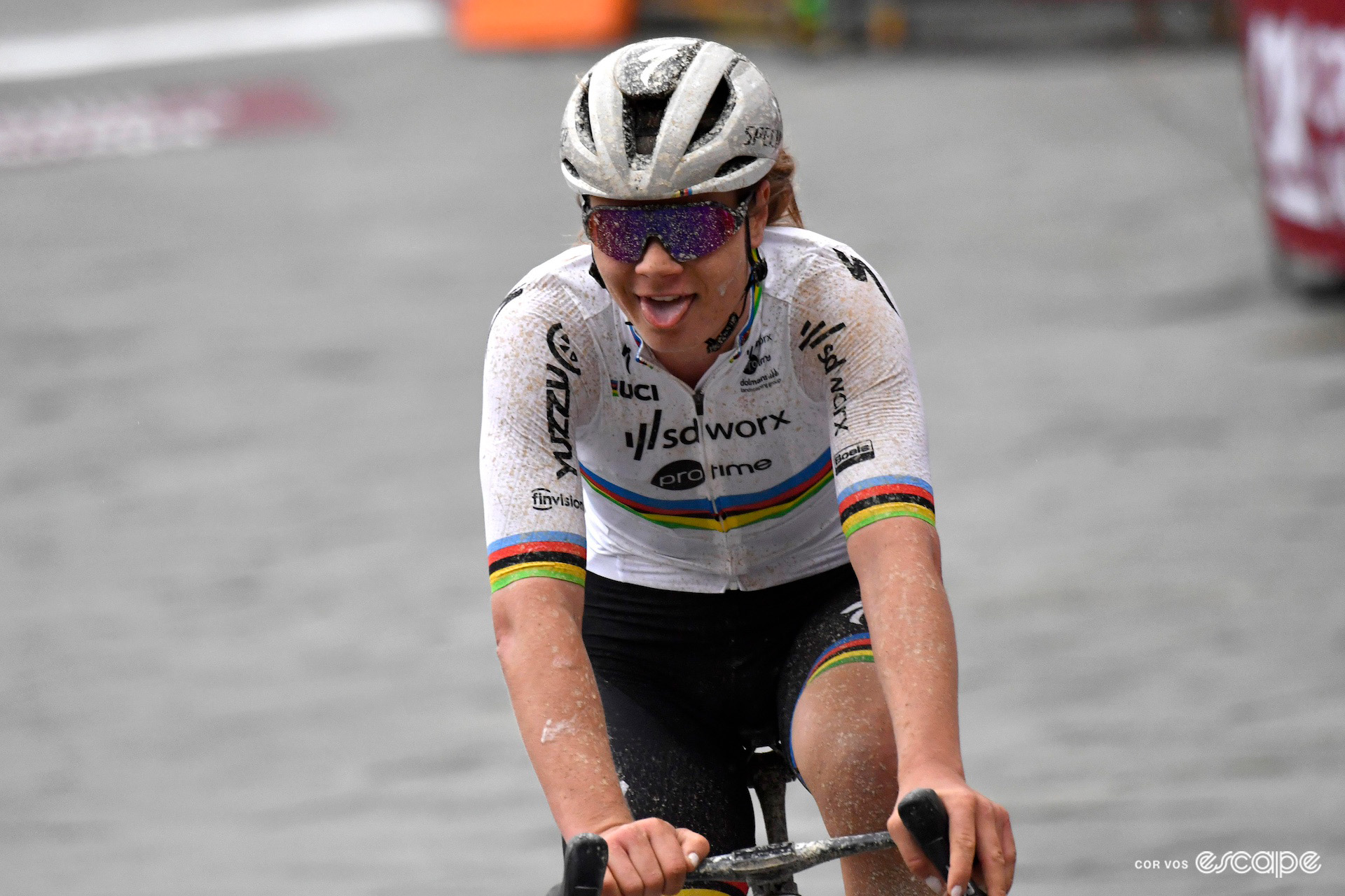 Lotte Kopecky sticks her tongue out in celebration on winning the 2024 women's Strade Bianche.