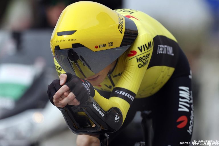 Jonas Vingegaard time trials at the 2024 Tirreno-Adriatico stage race. He's in a supremely aero tuck and everything about his gear is aero-focused, down to the radical new Giro time trial helmet that protrudes off the front of his head.