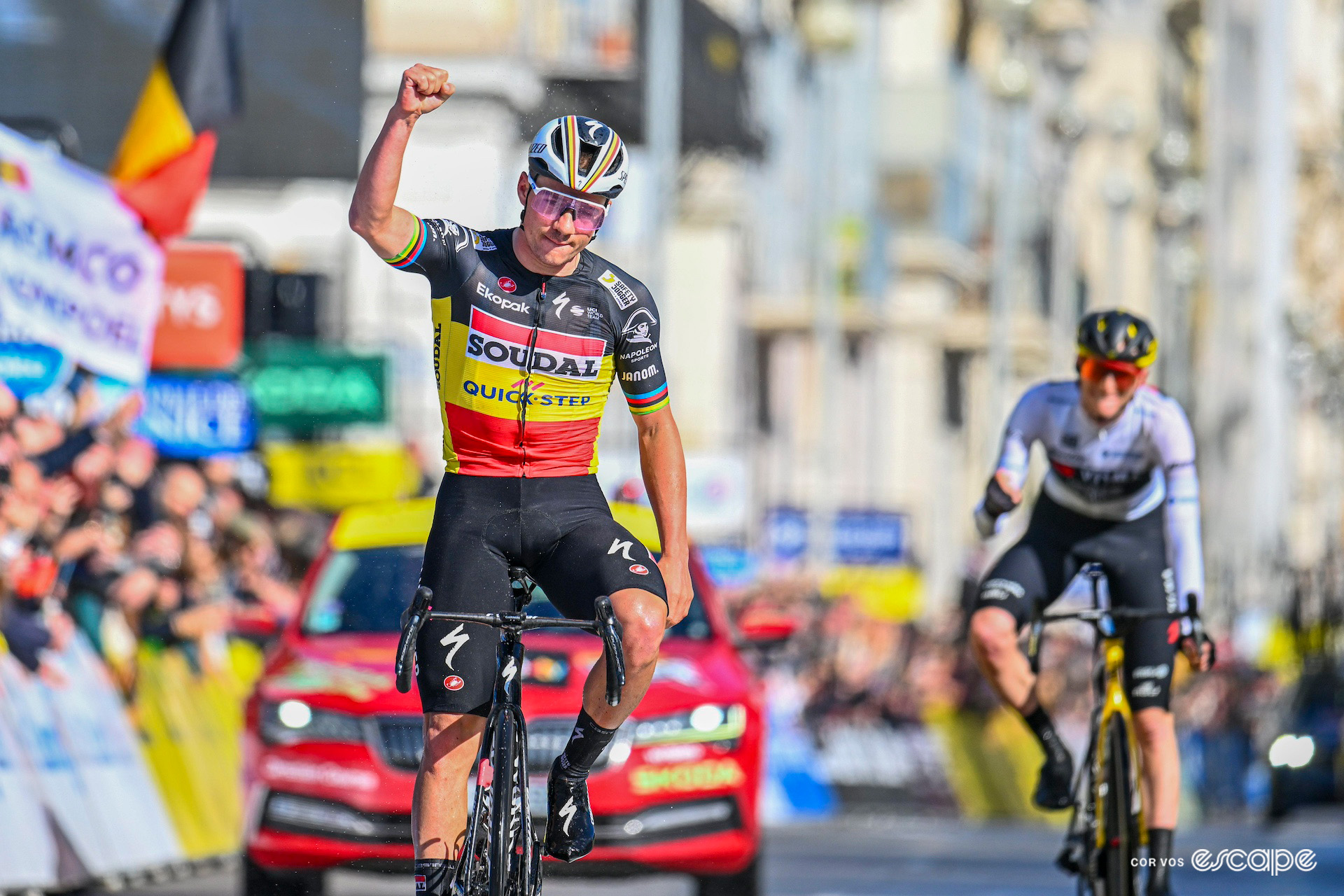 Remco Evenepoel, in the Belgian national champion's jersey, celebrates winning stage 8 of Paris-Nice 2024 ahead of overall winner Matteo Jorgenson.