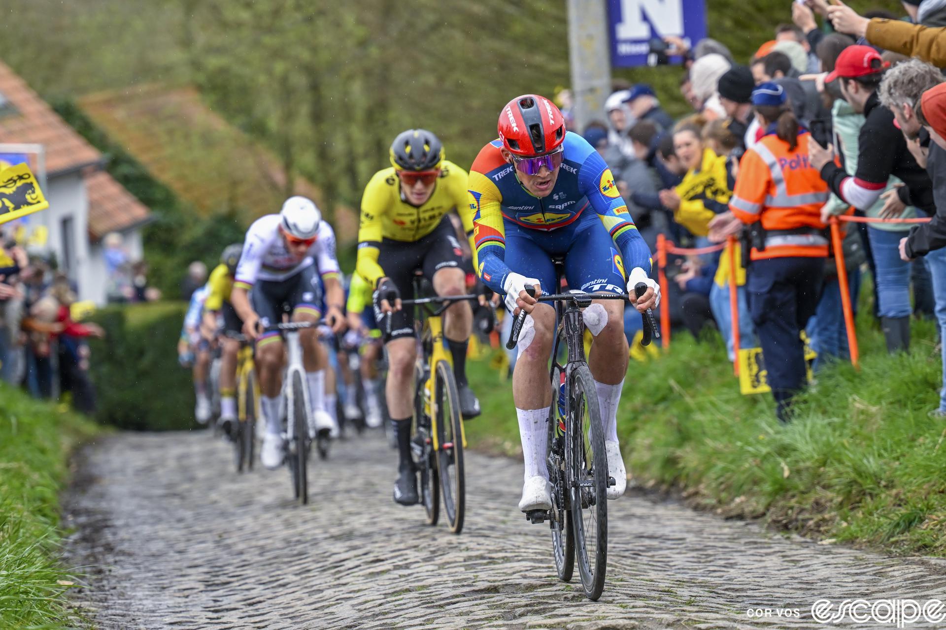 Mads Pedersen lays down an attack on the cobbles at the Tour of Flanders as Matteo Jorgenson attempts to bridge. Mathieu van der Poel is just behind.