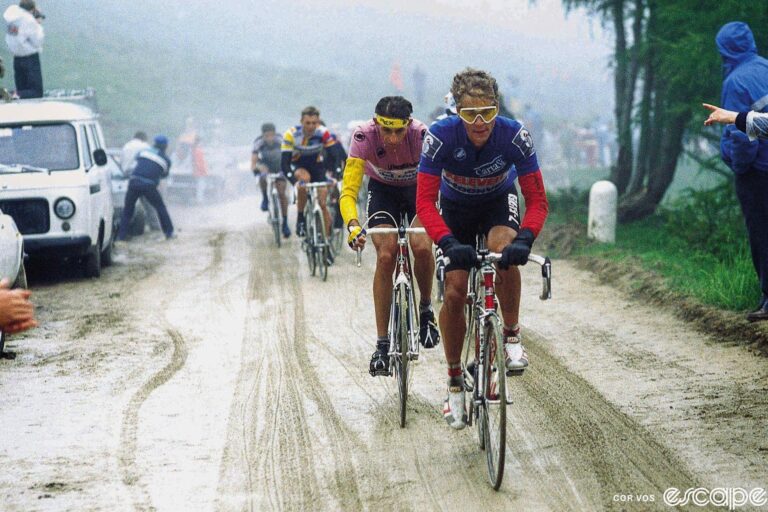 Andy Hampsten leads race leader Franco Chioccioli on the Passo di Gavia at the 1988 Giro d'Italia. The dirt road has turned to mud in the rain and snow, a harbinger of what's to come. Hampsten looks chilly but contained, while an underdressed Chioccioli, who is about to be dropped, looks thoroughly miserable.