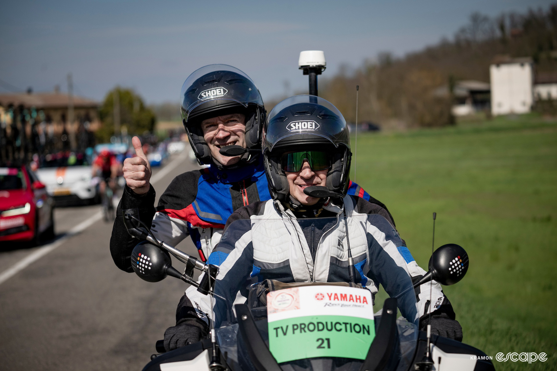 Jens Voigt gives a thumbs up from a TV production moto during Milan-San Remo 2024.