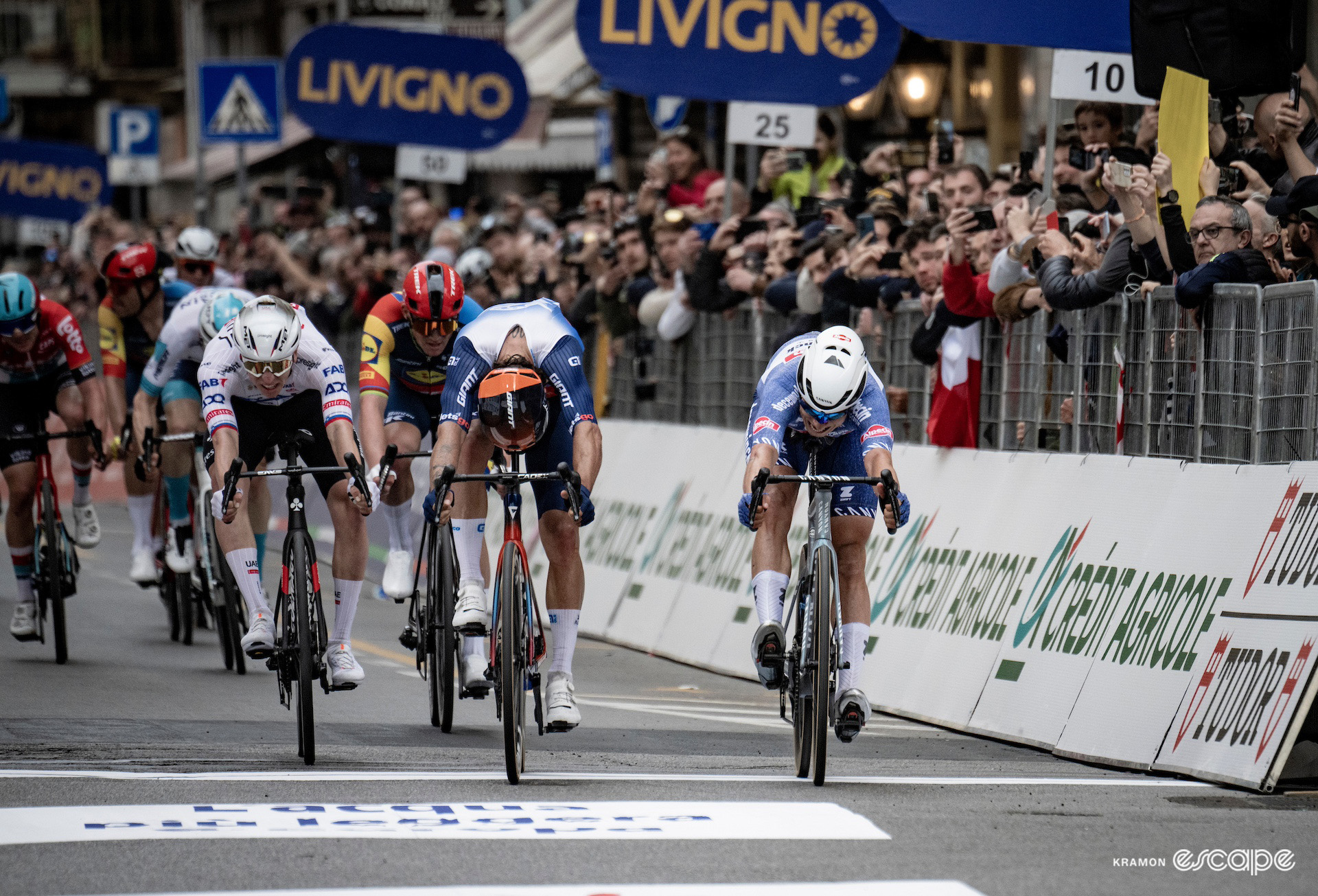 Jasper Philipsen and Michael Matthews in a close sprint for victory at Milan-San Remo 2024.