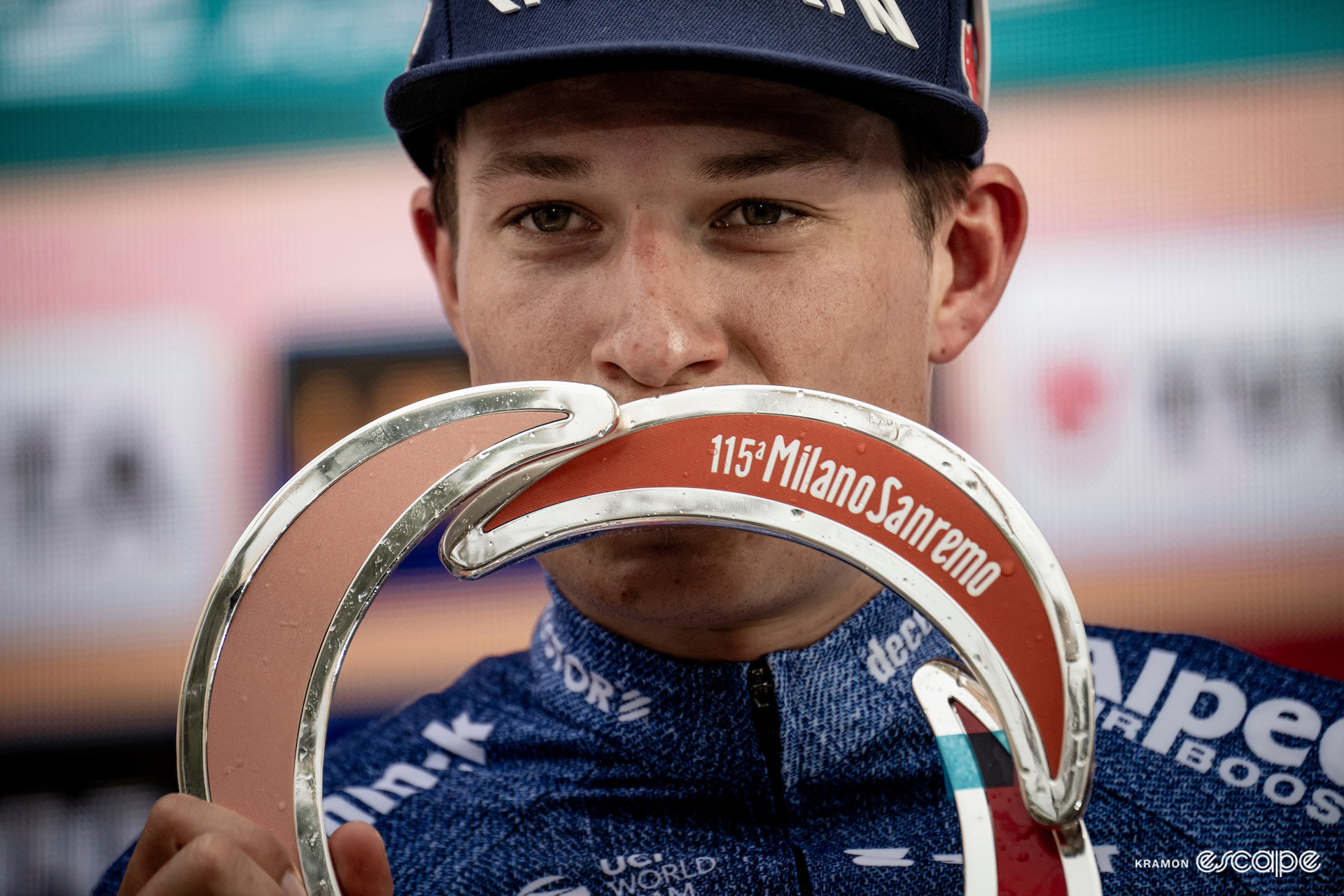 Jasper Philipsen with the Milan-San Remo 2024 winner's trophy.