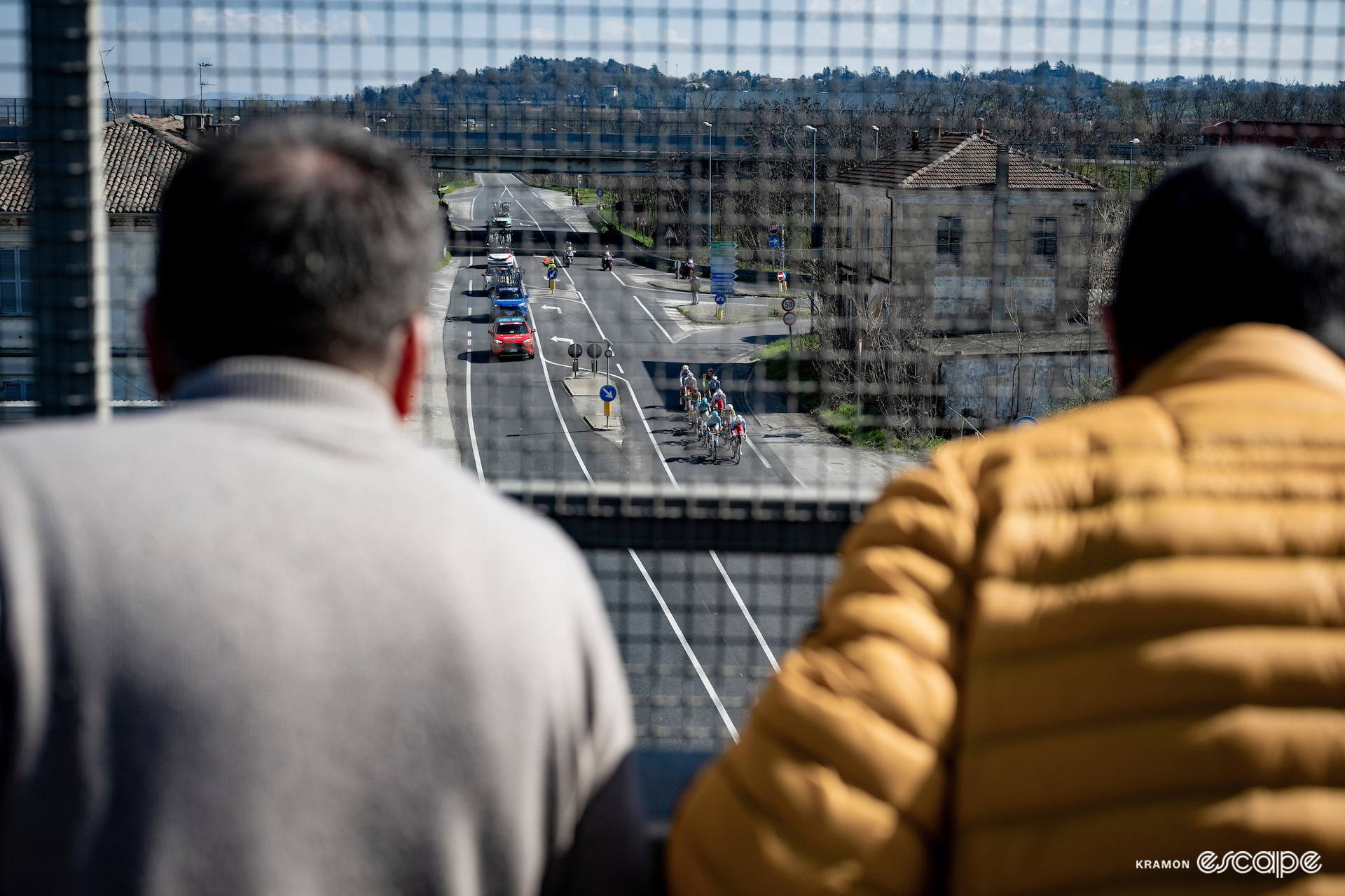 Spectators watch the breakaway from an overpass during Milan-San Remo 2024.