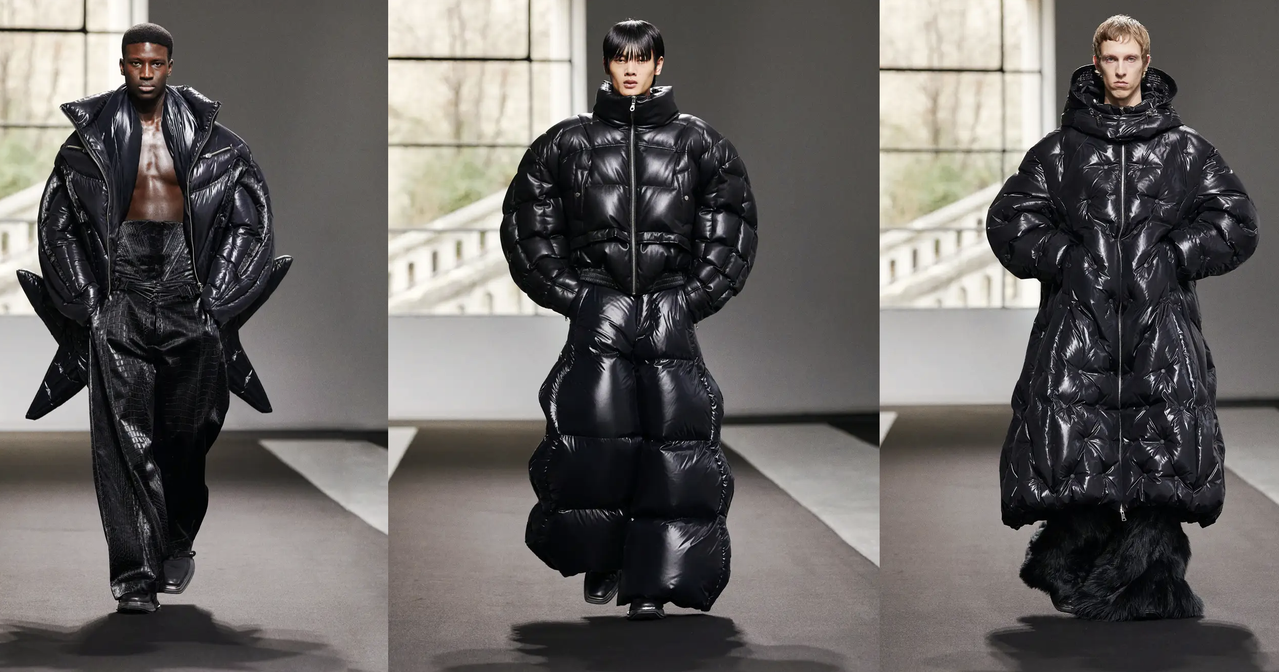 Models walk the runway in a presentation of designer Chen Peng's haute couture collection. The three men are all dressed in wildly fanciful down coats, which feature black nylon shells over panels of poofy down in futuristic shapes that cover them from head to toe, like a Darth Vader version of the Michelin Man.