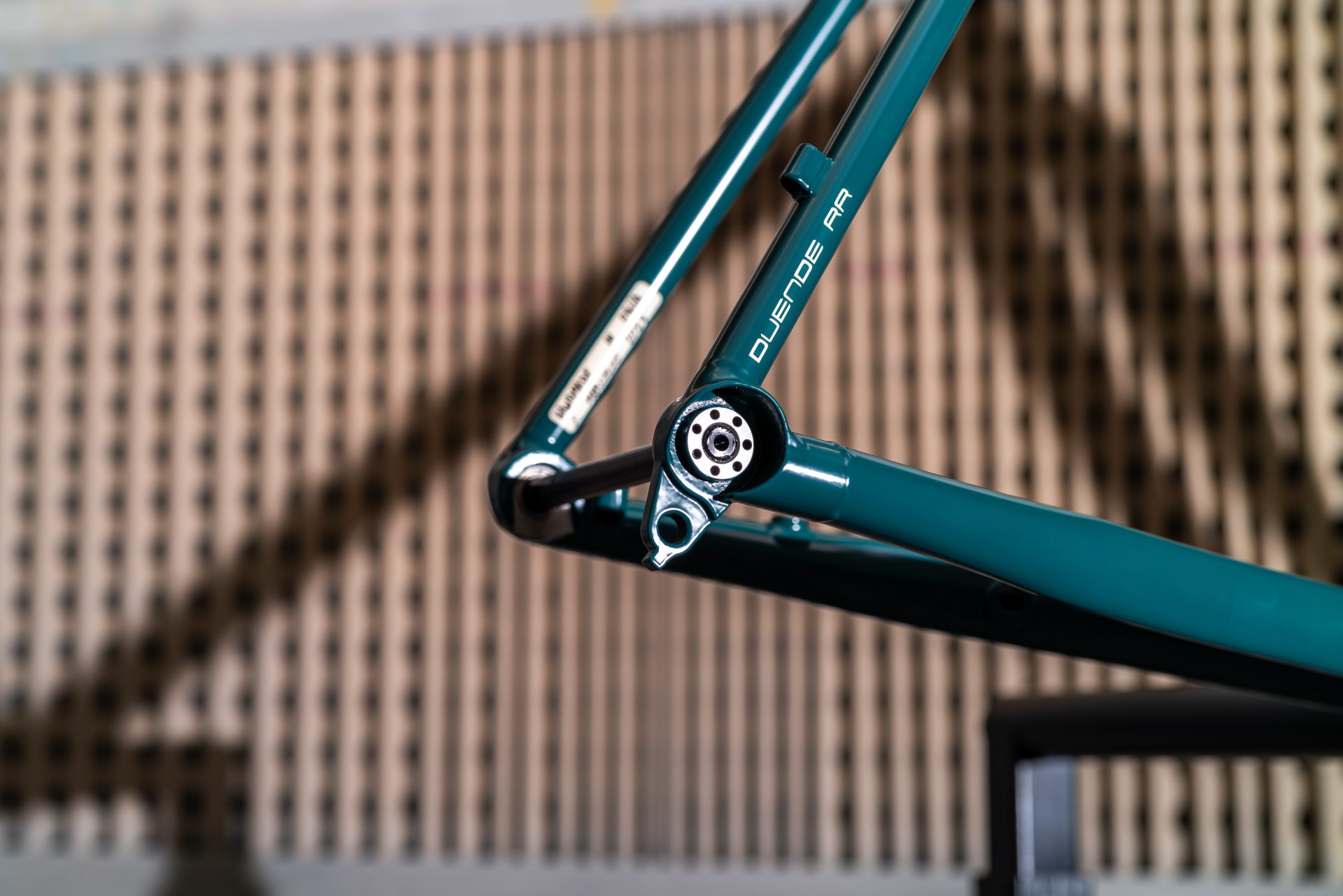 The rear triangle of the Pegoretti Duende Rock & Roll, with a through-axle dropout. The dropouts are hooded and attach cleanly to the seat and chainstays.