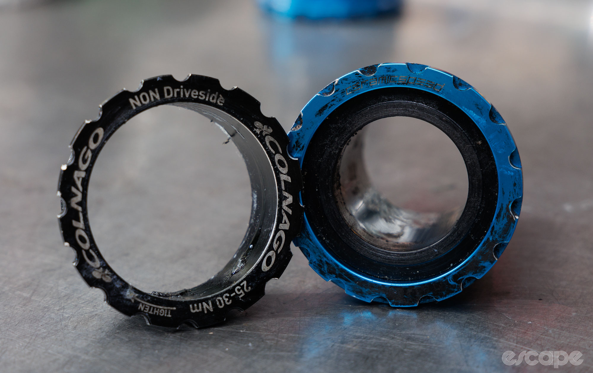 Colnago T45 cup on the left showing a spline without a backing plate. CeramicSpeed T47 Internal cup on the right, showing a bottom bracket cup with a backing plate. 
