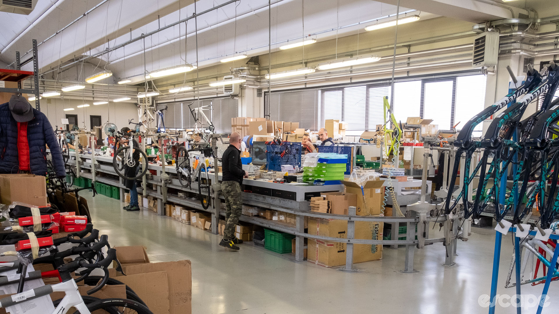 The photo shows a wide shot of Wilier's assembly line from one corner