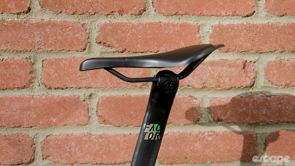 The image shows how a Wove Mags carbon fibre bike saddle looks mounted in the forward position on a seat post. The curved rear and falt front reminds the author of a platypus. 