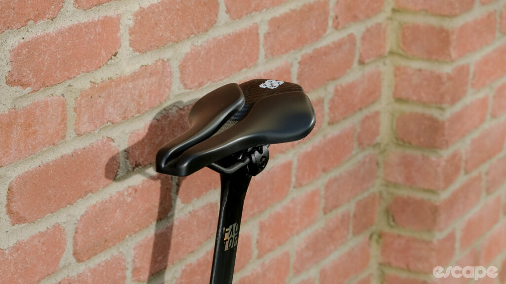 The image shows a head on view of the Wove Mags carbon fibre bike saddle.