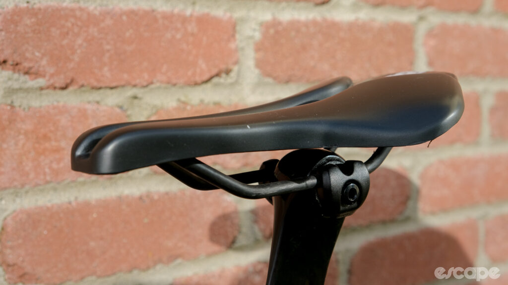 The image shows a side-on view of the Wove Mags carbon fibre bike saddle.
