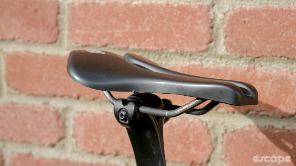 The image shows a side on view of the Wove Mags carbon fibre bike saddle.