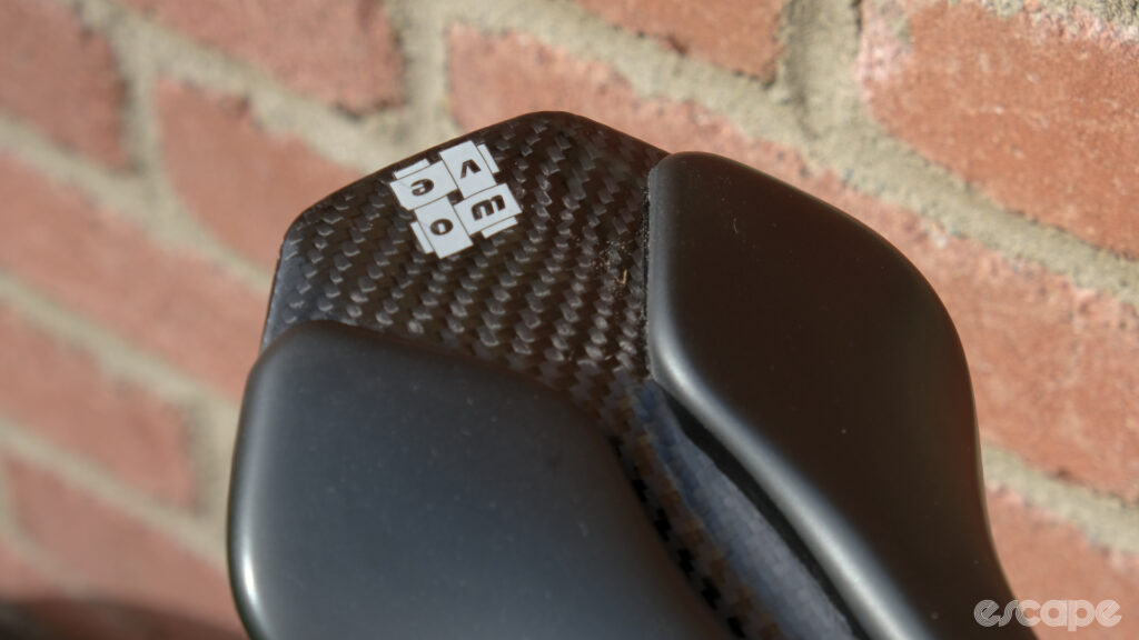 The image shows the carbon tail on a Wove Mags carbon fibre bike saddle.