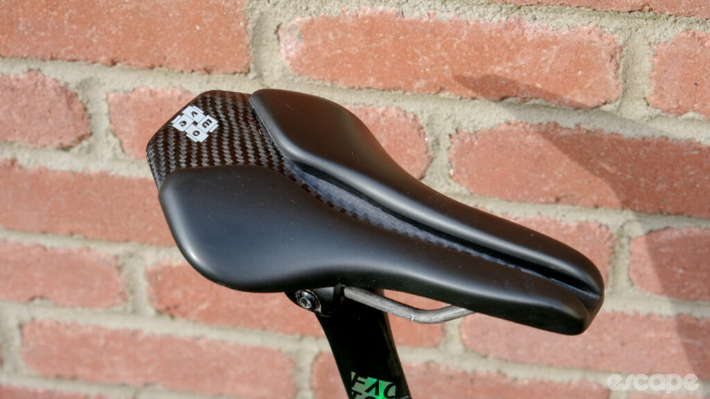 The image shows a Wove Mags carbon fibre bike saddle.