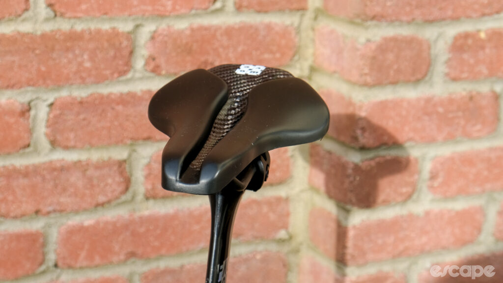 The image shows a head on view of the Wove Mags carbon fibre bike saddle.