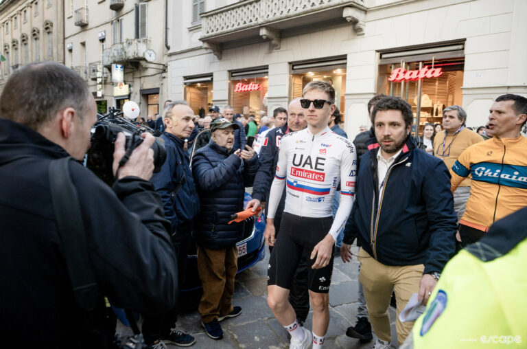 Tadej Pogačar being escorted through Pavia to the team presentation for Milan-San Remo 2024.