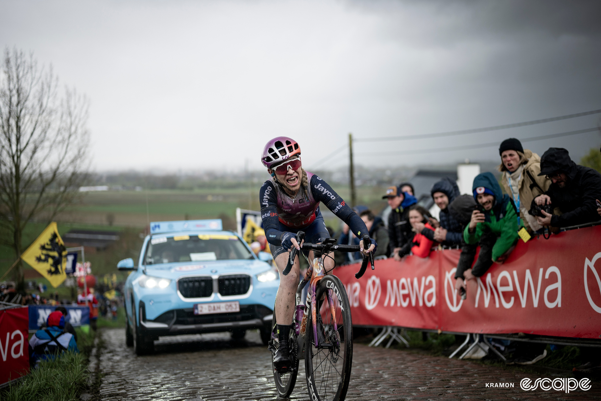 Letizia Paternoster grimaces as she climbs the cobbles in the Tour of Flanders.