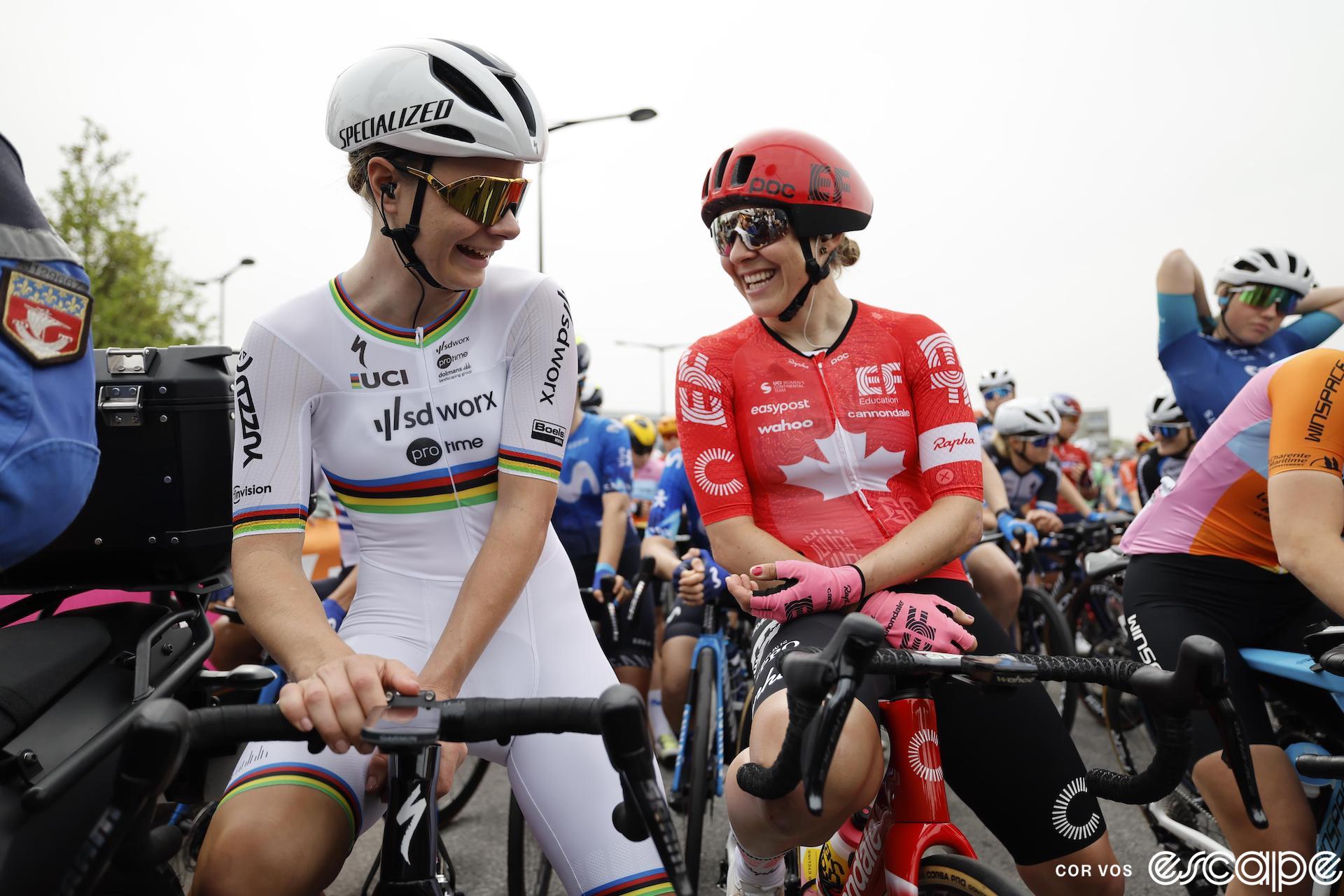 Alison Jackson laughs with Lotte Kopecky at the start of the 2024 Paris-Roubaix Femmes.