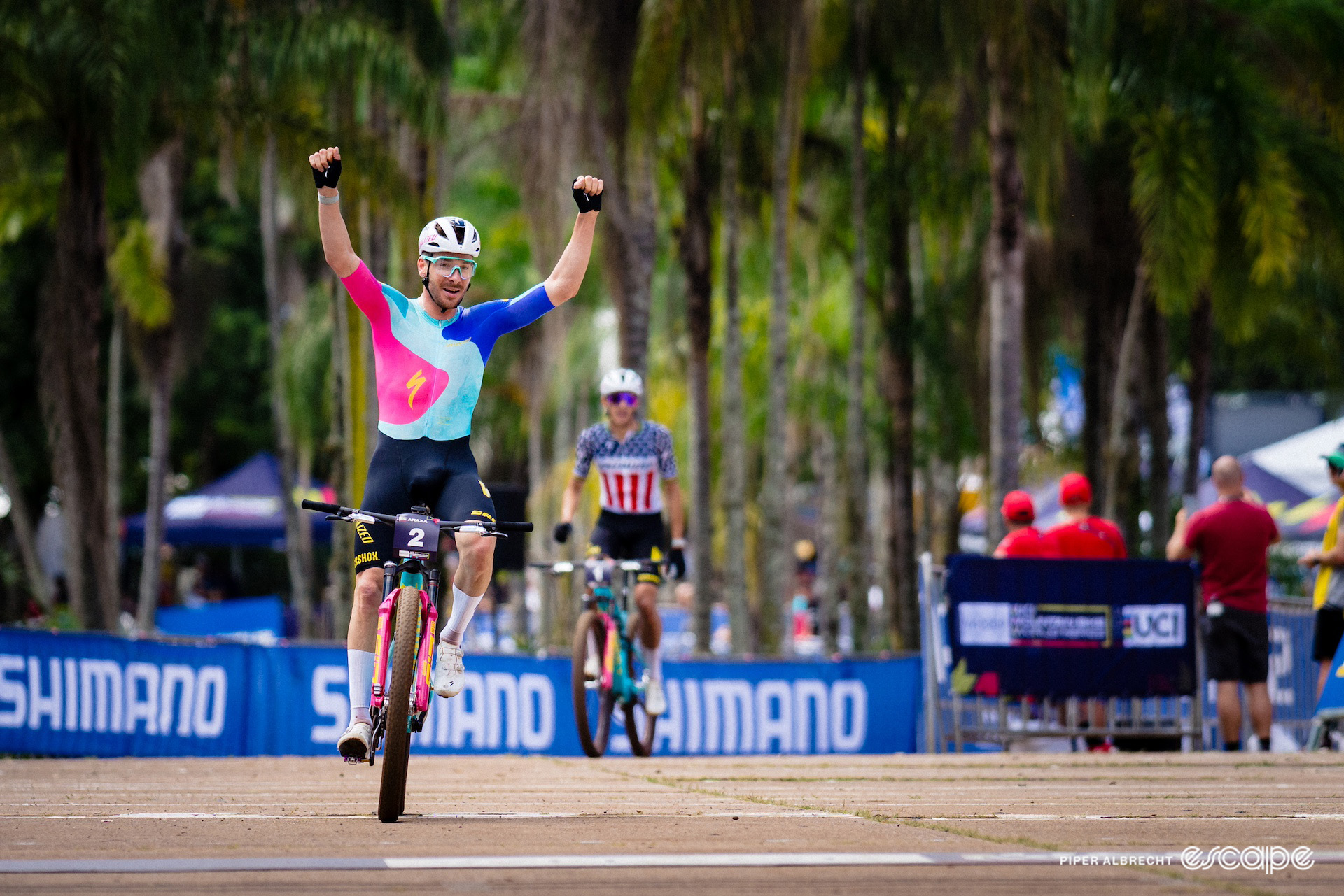 Victor Koretzky raises his arms in celebrations at winning mountain bike World Cup short track in Araxá, Brazil.