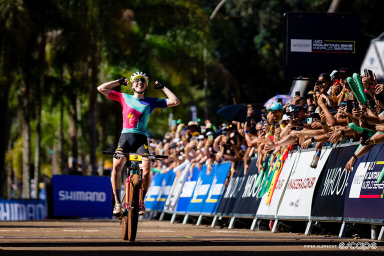 Haley Batten celebrates winning a World Cup cross-country mountain bike title in Araxá, Brazil.