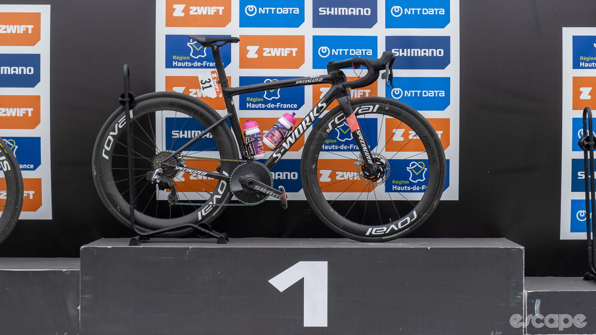 The image shows Lotte Kopecky's S-Works Tarmac SL8 on the Roubaix podium. 