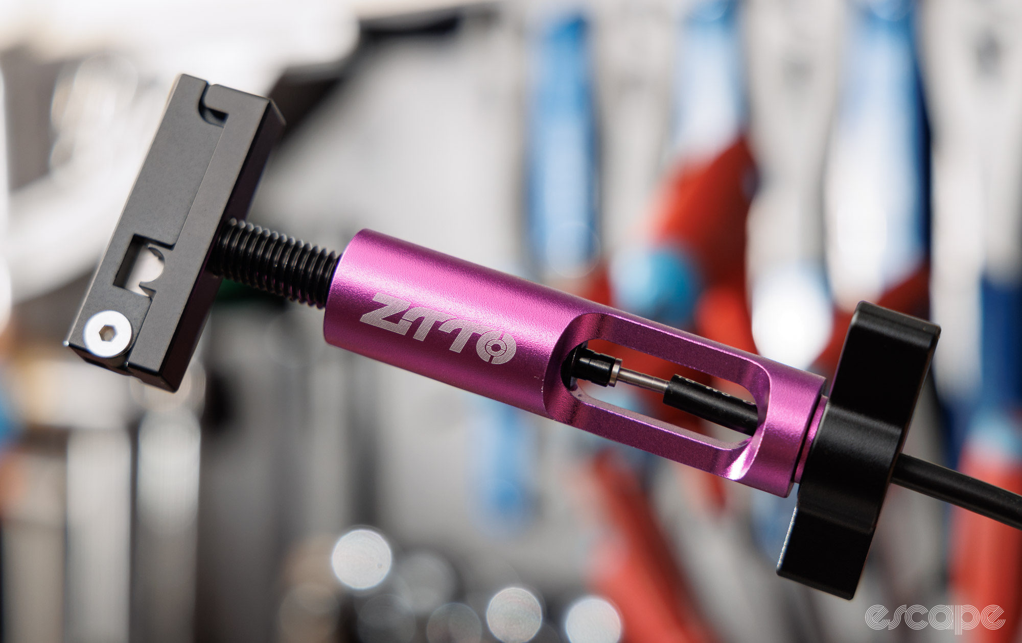 ZTTO hose barb tool being used to install a barb in a Shimano BH90 hose. 
