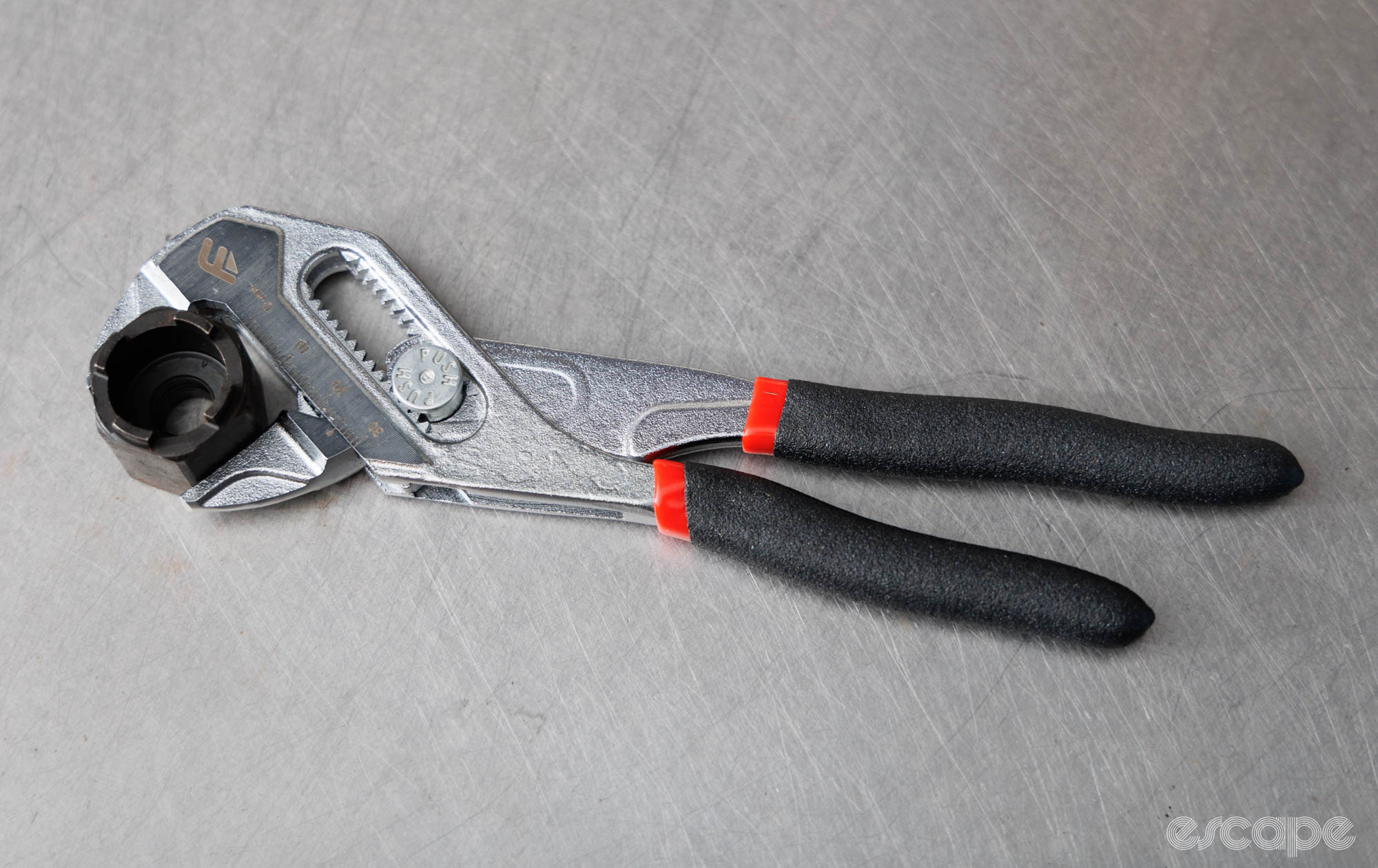 Feedback Sports Pliers Wrench clamping onto a freewheel socket. 
