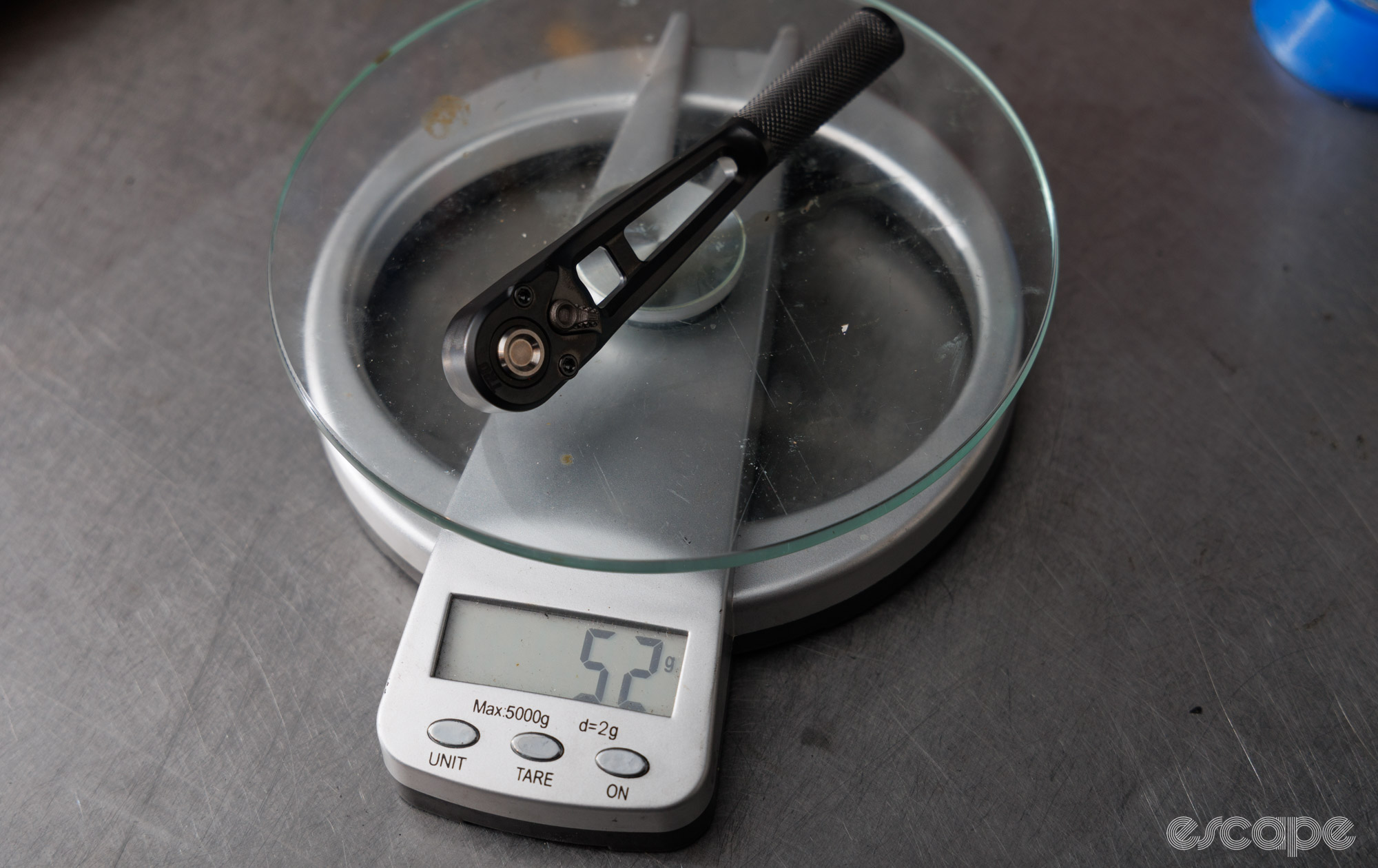 A TRO Designs Titanium ratchet on some kitchen scales. It reads 52 grams. 